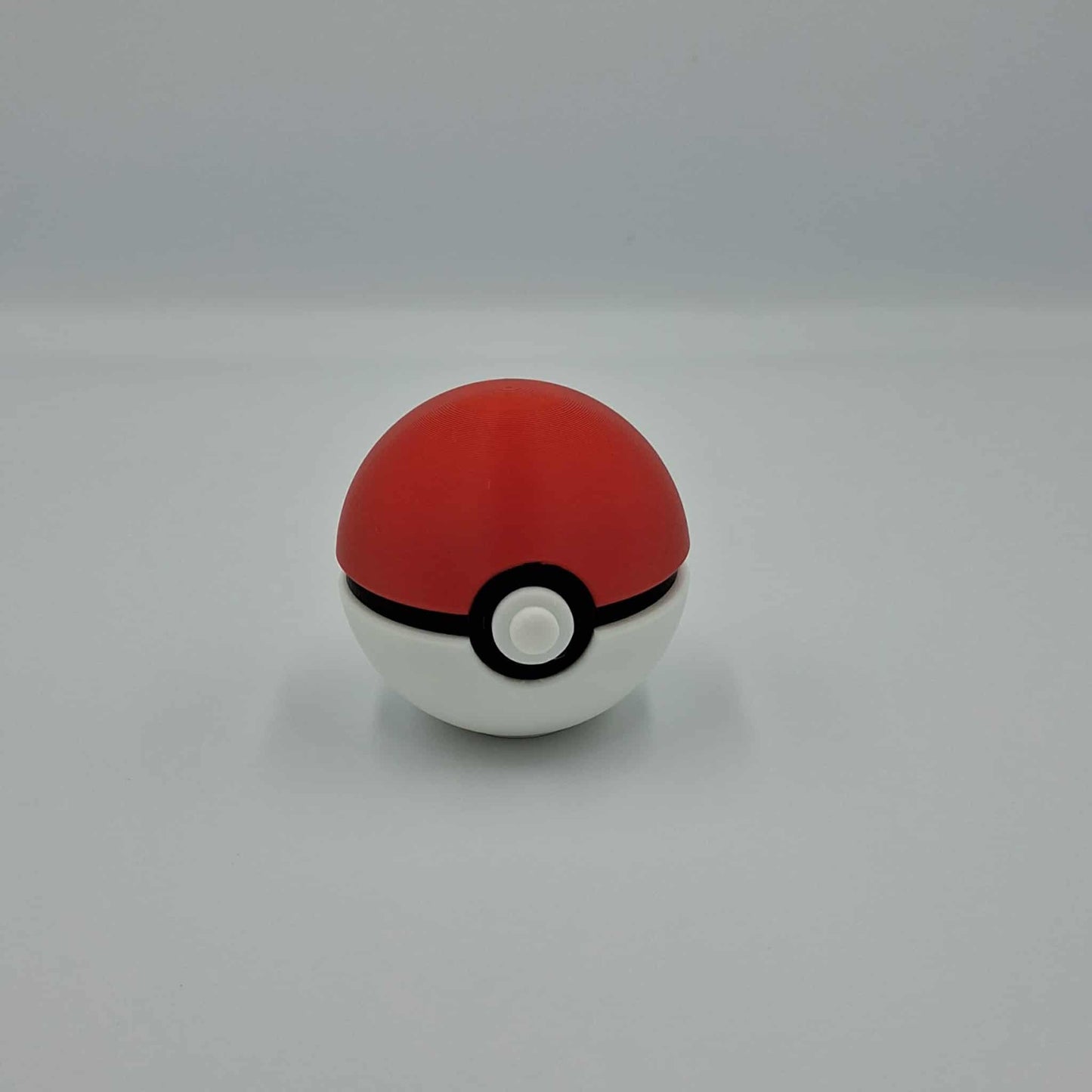 "3D printed original-style Poké Ball inspired collectible in red and white"