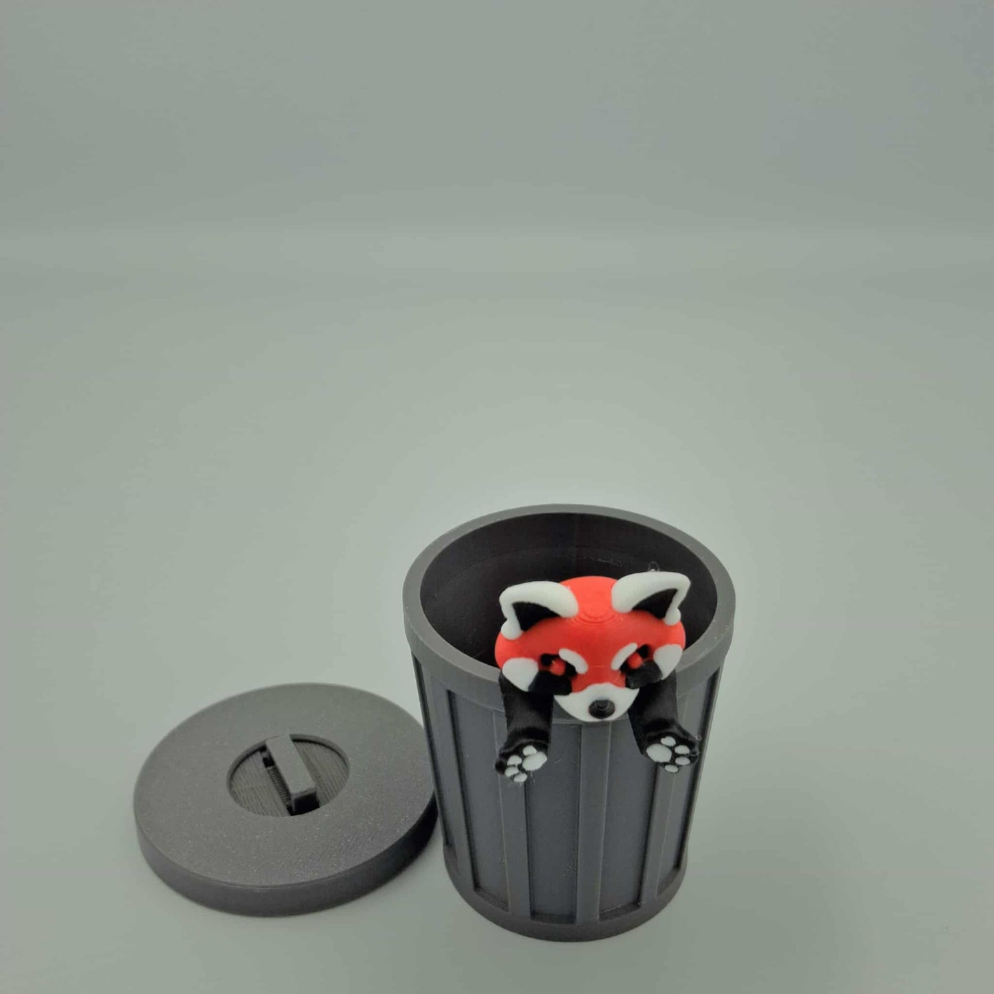 Red Panda with trash can