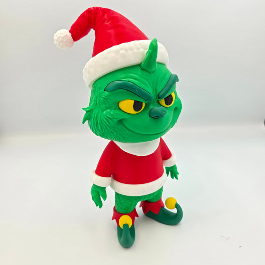 “3D printed Grinch Santa figure holding a gift bag – handmade Christmas holiday decoration in PLA.”
