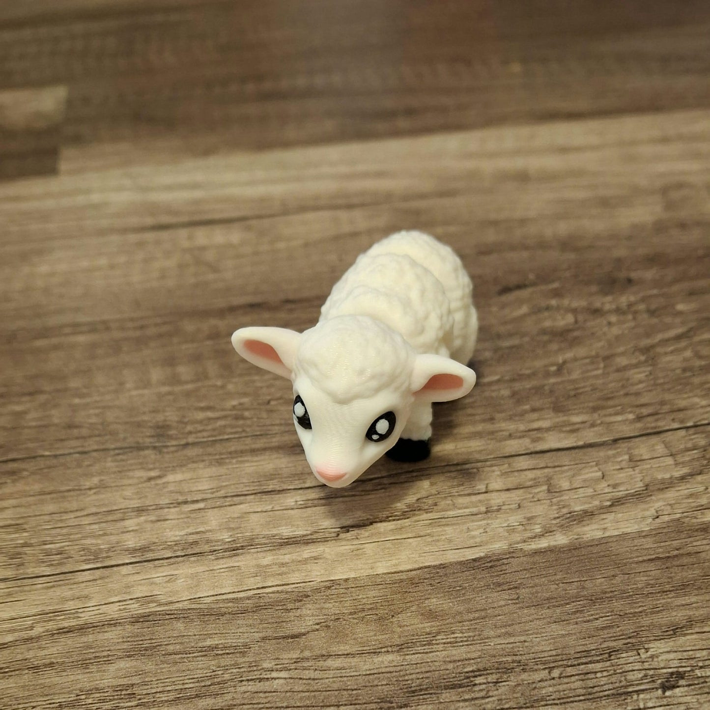 “Articulated 3D printed little lamb figure with movable legs and flexible body – cute farm animal toy.”