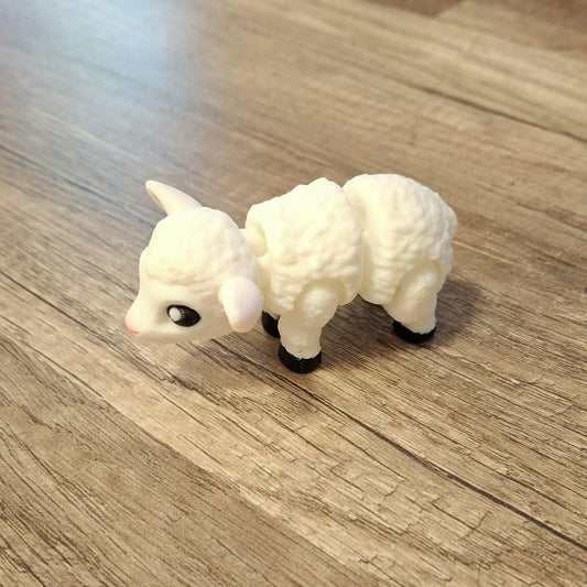 “Articulated 3D printed little lamb figure with movable legs and flexible body – cute farm animal toy.”