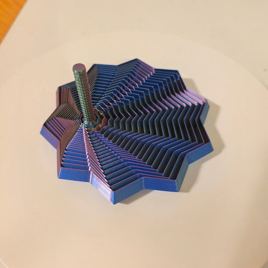 "Articulated 3D printed fidget star toy with expanding layered segments and built-in handle"